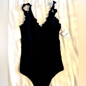 Free People black bodysuit. New w/tags. XS/S.